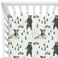 a bear themed crib sheet with trees and mountains