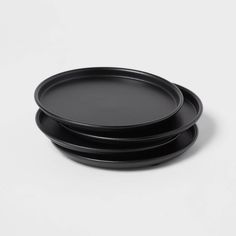 three black plates stacked on top of each other