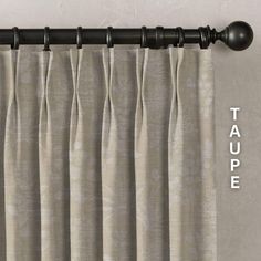 an image of a curtain with tape on the top and bottom, in front of a wall