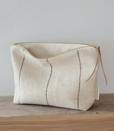 a white bag sitting on top of a wooden table