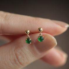 Mini gold Jade earrings, grade A jadeite studs, Imperial green Jade earrings, real Burmese jade, modern jade earrings, gift for her.  C H A R A C T E R I S T I C S - Metal: 18K solid gold with Au750 hallmark - Jade quality: Natural grade A Jade gemstone  - Jade origin : Burma  - Jade size: 3.5 mm - Earring size: 9 mm - Sold per pair  - Preorder, ready to Ship in 5-8 business days Green Stud Earrings, Imperial Jade, Earrings Real, Burmese Jade, Earrings Emerald, Mini Gold, Mini Earrings, Jade Gemstone, Jade Earrings