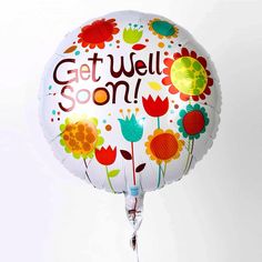 a balloon that says get well soon with flowers and leaves on the bottom saying, get well soon