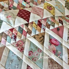 a close up view of a quilt made from old fabrics