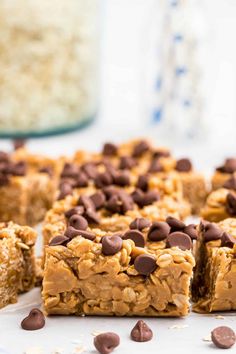 chocolate chip granola bars cut into squares and stacked on top of each other