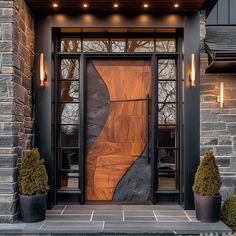 the front door is decorated with wood and glass panels, along with potted plants