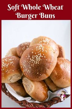 a basket filled with buns covered in sesame seeds