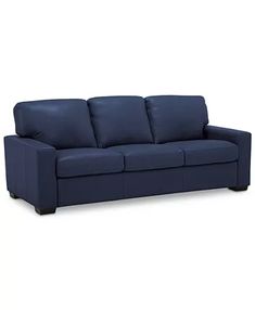 a blue couch sitting on top of a white floor