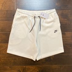 Men’s White Nike Tech Fleece Sweat Shorts Size Xl Brand New With Tags Super Soft And Comfortable Above The Knee Fit Measurements- Inseam 8 Inches 2 Front Hand Pockets 1 Back Zipper Pocket Message For Questions White Sports Shorts With Side Pockets, White Sports Sweatpants With Side Pockets, White Sweatpants With Side Pockets For Sports, Nike White Sweatpants For Leisure, Nike White Leisure Bottoms, Nike White Leisure Sweatpants, White Nike Sweatpants For Leisure, White Casual Moisture-wicking Sweatpants, Nike White Sweatpants With Pockets