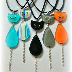 six cat necklaces with different colors and designs