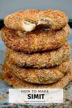 sesame seed bagels stacked on top of each other