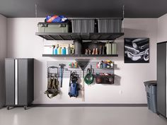 an organized garage with various items hanging on the wall