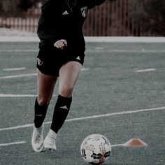 a female soccer player in action on the field