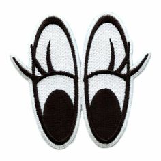 two black and white shoes with horns on them