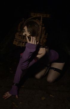 a woman in purple is sitting on the ground and talking on her cell phone while wearing stockings