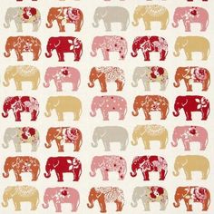 an elephant pattern on white fabric with red and yellow elephants in the middle, all facing different directions