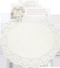 a white doily with a teddy bear on it