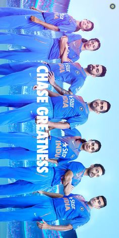 the cheerleaders are wearing blue uniforms and posing for a photo in front of an advertisement