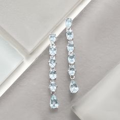 Ross-Simons - 5.30 ct. t. w. Aquamarine Linear Drop Earrings in Sterling Silver. Bask in the glow of blue with these drop earrings. Set in polished sterling silver, 5.30 ct. t. w. oval and pear-shaped aquamarines sway and shine with every step. Hanging length is 1 3/4". Post/clutch, aquamarine linear drop earrings. Aquamarine birthstones are the perfect gift for March birthdays. Blue Earrings Wedding, Blue Bridal Earrings, Coral Drop Earrings, Sky Blue Topaz Ring, Blue Aquamarine Ring, Emerald Earrings Drop, Blue And White Wedding, Jewelry Presentation, Opal Drop Earrings