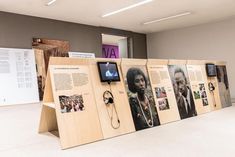 an exhibit with many different types of information on the wall and in front of it