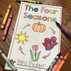 the four seasons coloring book with crayons and markers next to it on a table