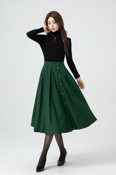 This green midi wool skirt has single-breasted design.  The attention to detail in the construction of this high waist circle skirt is evident in every stitch, show casing the craftsmanship and expertise that went into its creation.  DETAIL * 30% wool, 30% fiber, 40% polyester * Fully satiny lining, more nice to the touch body * Two side seam pockets * Front button closure, Button down skirt * Elastic waist at back, Plus size skirt * Midi wool skirt * Wool skirt women * High waist skirt, A Line skirt * For autumn and winter * Dry clean * Lean More about the items From the FAQs on the page bottom MODEL SIZE Bust 85 cm(33.4") Waist 67 cm(26.7") Height 168cm (5' 6") She wears size XS Choose CUSTOM Order if you * Need a better fit * Can't find your size in our size Chart * Change the Style * C Green Lined Skirt For Fall, Green Lined Midi Pleated Skirt, Green Lined Maxi Skirt For Fall, Fall Green Lined Maxi Skirt, Green Maxi Skirt For Work, Green Midi Skirt Bottoms For Winter, Green Pleated Maxi Skirt For Fall, Chic Green Skirt For Winter, Chic Green Winter Skirt