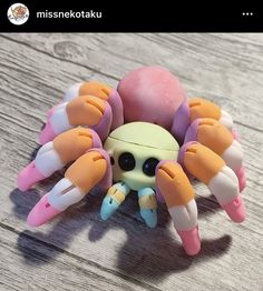 a close up of a toy spider on a table