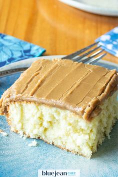 a piece of cake sitting on top of a blue plate with a fork in it