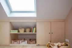 a child's room with bookshelves and toys