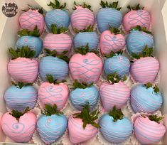 chocolate covered strawberries with pink and blue frosting