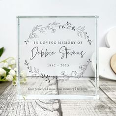 an acrylic glass block with the words in loving memory of debra stevens