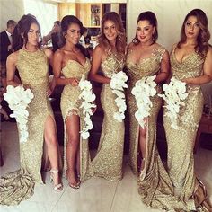 the bridesmaids are wearing gold dresses with white flowers on their bouquets and one is