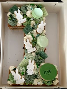 the letter e is made out of cupcakes and decorated with green icing