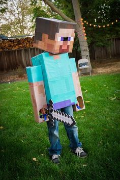 a young boy dressed up in a minecraft costume