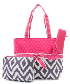 two purses, one in pink and the other in black and white with a bow