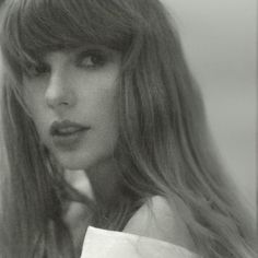 a black and white photo of a woman with long hair