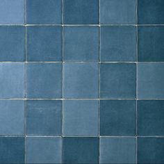 a blue tiled wall with no one in it