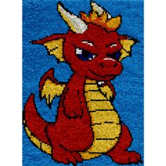 a rug with a red and yellow dragon on it's face, in front of a blue background