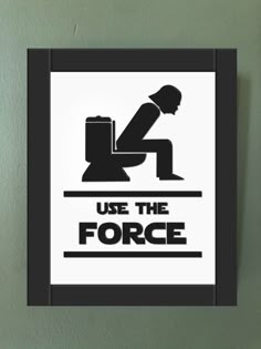 a black and white sign that says use the force with a man sitting on a toilet