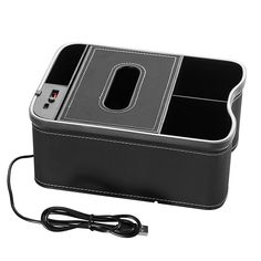 a black box with two compartments and a charger plugged into the back side