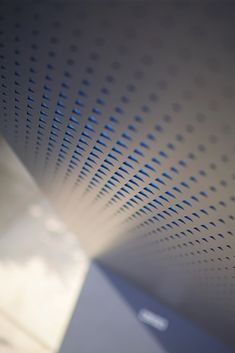 a close up view of the ceiling in a room with blue and white dots on it