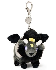 a black and white stuffed animal on a keychain