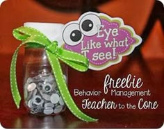 a mason jar filled with buttons and a green ribbon tied around the top that says freebie behavior management teacher to the core