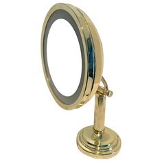 a gold colored mirror on top of a metal stand against a white background with clippings