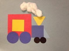 a paper cut out of a train with clouds above it