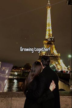 a man and woman hugging in front of the eiffel tower with text reading growing together