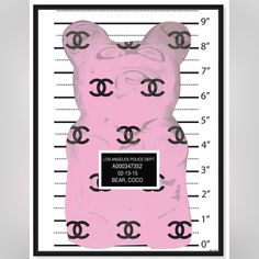 a pink teddy bear with chanel logo on it's chest is mugged in front of a police line