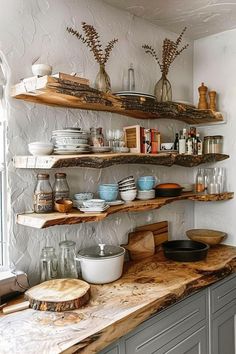 the shelves in the kitchen are filled with dishes