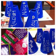 blue plastic cones with writing on them sitting on top of a table next to other items