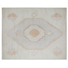 an old rug with geometric designs on the front and back sides, in beige tones