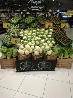 an assortment of vegetables on display in a grocery store